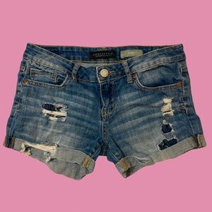 Women's distressed denim shorts
